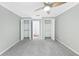 Bright bedroom featuring ample closet space and ceiling fan at 707 Cumberland Se Ct, Smyrna, GA 30080