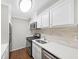 Modern kitchen with white cabinets and stainless steel appliances at 707 Cumberland Se Ct, Smyrna, GA 30080