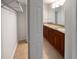 Bathroom with double vanity, tile flooring, and walk-in closet at 6520 Roswell Rd # 68, Atlanta, GA 30328