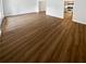 Open living room with wood-look floors and access to patio at 6520 Roswell Rd # 68, Atlanta, GA 30328