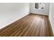 Spacious living room featuring wood-look floors and large windows at 6520 Roswell Rd # 68, Atlanta, GA 30328