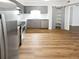 Modern kitchen with gray cabinets, granite counters, and stainless steel appliances at 6520 Roswell Rd # 68, Atlanta, GA 30328