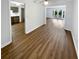 Open concept living and dining area with wood-look floors at 6520 Roswell Rd # 68, Atlanta, GA 30328