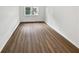 Bright and spacious living room with new flooring and large window at 6520 Roswell Rd # 68, Atlanta, GA 30328