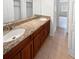 Double vanity bathroom with granite countertops and ample storage at 6520 Roswell Rd # 68, Atlanta, GA 30328