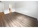 Bright bedroom with wood-look floors and access to a bathroom at 6520 Roswell Rd # 68, Atlanta, GA 30328