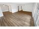 Spacious living area with wood-look floors and access to multiple rooms at 6520 Roswell Rd # 68, Atlanta, GA 30328