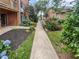 Paved walkway with lush landscaping leading through the community at 6520 Roswell Rd # 68, Atlanta, GA 30328