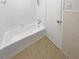 Clean bathroom with a bathtub, tile flooring and white walls at 6520 Roswell Rd # 68, Atlanta, GA 30328