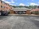 Brick building exterior with awning and parking at 6520 Roswell Rd # 68, Atlanta, GA 30328