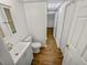 Clean bathroom with a modern vanity, toilet, and wood-look floors at 120 Blackberry Run, Fayetteville, GA 30214