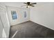Bright bedroom with gray carpet, double closets, and natural light at 120 Blackberry Run, Fayetteville, GA 30214