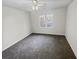 Bright bedroom with large window and carpet at 120 Blackberry Run, Fayetteville, GA 30214