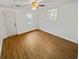 Bright bedroom with wood-look floors, ceiling fan, and exterior access at 120 Blackberry Run, Fayetteville, GA 30214