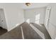 Bright bedroom with neutral walls and carpet at 120 Blackberry Run, Fayetteville, GA 30214