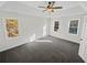 Well-lit bedroom, featuring ceiling fan and carpet at 120 Blackberry Run, Fayetteville, GA 30214