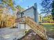 Two-story house with attached garage, deck, and stairs at 120 Blackberry Run, Fayetteville, GA 30214