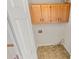 Laundry room with wooden cabinets and vinyl flooring at 120 Blackberry Run, Fayetteville, GA 30214