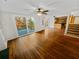 Living area with hardwood floors, sliding glass doors leading to a deck, and built-in shelving at 120 Blackberry Run, Fayetteville, GA 30214