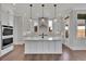 Kitchen with large island, white cabinets, and granite counters at 1356 Flora Dr, Conyers, GA 30094