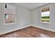 Bright bedroom with hardwood floors and large windows offering natural light at 1356 Flora Dr, Conyers, GA 30094