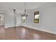 Spacious dining room with hardwood floors and chandelier at 1356 Flora Dr, Conyers, GA 30094