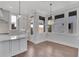 Bright breakfast nook with hardwood floors and large windows at 1356 Flora Dr, Conyers, GA 30094
