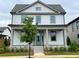 Two-story Craftsman home with a front porch and landscaping at 1356 Flora Dr, Conyers, GA 30094
