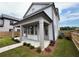 Home with covered patio, landscaping, and detached garage at 1356 Flora Dr, Conyers, GA 30094