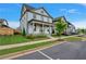 Two-story home with front yard, landscaping, and a green door at 1356 Flora Dr, Conyers, GA 30094
