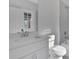 Simple bathroom with white vanity, toilet and bathtub at 1356 Flora Dr, Conyers, GA 30094