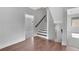 Modern staircase with hardwood floors and wooden railing at 1356 Flora Dr, Conyers, GA 30094