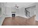 Living room with hardwood floors, fireplace, and staircase at 1356 Flora Dr, Conyers, GA 30094