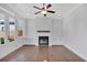 Living room with hardwood floors, fireplace, and built-in shelving at 1356 Flora Dr, Conyers, GA 30094