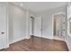 Simple bedroom with hardwood floors and access to a full bathroom at 1356 Flora Dr, Conyers, GA 30094
