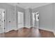 Spacious hallway with hardwood floors and access to other rooms at 1356 Flora Dr, Conyers, GA 30094