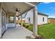 Covered patio with access to backyard and detached garage at 1356 Flora Dr, Conyers, GA 30094