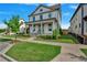 Two-story home with front yard, landscaping, and a green door at 1356 Flora Dr, Conyers, GA 30094