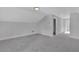 Spacious bonus room with gray carpeting and neutral walls at 1356 Flora Dr, Conyers, GA 30094