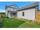 Home with backyard, detached garage, and grassy lawn at 1356 Flora Dr, Conyers, GA 30094