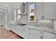 Kitchen with white cabinets, granite countertops, and stainless steel appliances at 1356 Flora Dr, Conyers, GA 30094