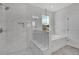 Modern bathroom with marble shower, soaking tub, and separate toilet at 1356 Flora Dr, Conyers, GA 30094