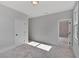 Bedroom with bathroom access and gray carpet at 1356 Flora Dr, Conyers, GA 30094