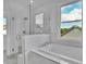 Elegant bathroom featuring a large walk-in shower and soaking tub at 1356 Flora Dr, Conyers, GA 30094