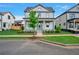 Two-story home with front yard, landscaping, and a green door at 1356 Flora Dr, Conyers, GA 30094