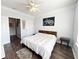 Spacious bedroom with ceiling fan, hardwood floors, and ample closet space at 401 16Th Nw St # 1157, Atlanta, GA 30363