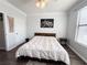 Spacious bedroom with ceiling fan, hardwood floors, and ample closet space at 401 16Th Nw St # 1157, Atlanta, GA 30363