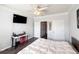 Spacious bedroom with wood-look floors, ceiling fan, and large bed at 401 16Th Nw St # 1157, Atlanta, GA 30363