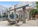 Apartment community courtyard with tables and umbrellas at 401 16Th Nw St # 1157, Atlanta, GA 30363