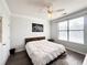 Bedroom with ceiling fan, wood-look floors, and large bed at 401 16Th Nw St # 1157, Atlanta, GA 30363